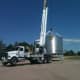 The crane must turn a few corners to get into position next to the hopper.