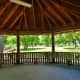 Inside a pavilion looking out at the park