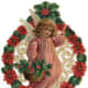 Vintage little girl Christmas angel surrounded by a wreath of holly