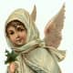 Vintage Christmas angel dressed in ivory coat with basket of flowers