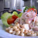 Halibut ceviche piled high and served with beans.