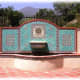 very large blue, teal and tan water fountain with terracotta tile patio - distinctively Mediterraneon