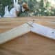 Joint where a pair of rafters meet. A pair of exterior screws is inserted in a crisscross pattern as shown.