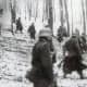 German troops cautiously approach American lines in the early morning hours of December 16, 1944.