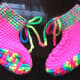 Side view of the neon pink slippers.