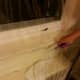Apply shrink wrap to the window along the path of the adhesive tape, leaving about five inches of overhang. Then cut off the overhang.