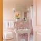 Martha Stewart's version of a vintage pink bathroom.  Old charm with a few modern twists like pink subway tiles.
