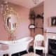 claw foot white tub in pink bathroom