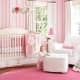 striped pink wallpaper in babies nursery