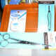 Dental Floss (good suture thread), tweezers and scissors