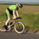 A rider aboard a Planet X Exocet Time Trial Bike in a panning photography shot