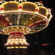 Knoebels Italian Trapeze, lit up at night.