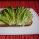 Add lettuce leaves to the slices of Graubrot spread with margarine.