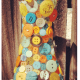 Colorful buttons on vase