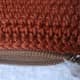I stitched on the LAST HDC round, so the zipper won't get caught in the crocheted purse.