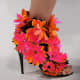 Pink pansies and orange accents. It's definitely a flower show