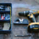 Tools for fitting, a spirit level, screwdriver and drill and wall plugs