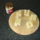 Dijon mustard is spread on the sub roll pieces