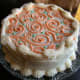 Fanciful orange and green swirls piped with buttercream.