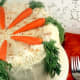 Natural approach with either marzipan carrots and real carrot fronds or real carrots.