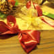 Make a satin bow that will be a little larger than the gold one. Make bow using 30&quot; of ribbon and wire the center.  See video if needed.