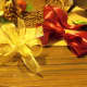 Gold ribbon cut 2 pieces 15" make bows and wire them together. Puff out the wire ribbon bow.