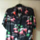 a flamingo shirt with a flamingo pin.