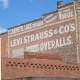 A Levi Strauss advertising sign painted on a brick wall in Woodland, California