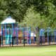 Gated Tot Lot play area in Ray Miller Park