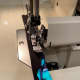 Cut your strip longer than you need and twice the width you want the neck strap. Sew right side together and turn right side out forming a flat tube.