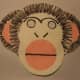 Overlapping paper plates can make more complex shapes like this monkey.