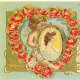 Cherub with a framed picture of a woman vintage Valentine's Day postcard