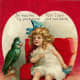 Cute kids: little girl with parrot Valentine's Day card