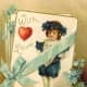 Cute kids: little boy with blue flowers and bow, red heart on a Victorian Valentine card