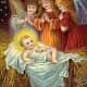 Three vintage angels with baby Jesus in the manger