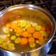 Put the carrot slices in boiling water for three minutes. This was the first batch, and all I had ready when the water boiled; you can put in more than this.