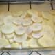Make your first potato layer about 2-3 potato slices thick so that about a fourth to a third of the depth of the pan is filled. You want the surface to be fairly even. This took me about two and a half potatoes. Sprinkle the layer with salt to taste.