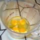 First, break the four eggs into the quart measuring cup.