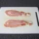 Chicken is laid on bacon rashers