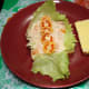 With tuna flakes mixture and tomato slices on top.