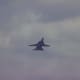 An F-14 with its wings extended during a flight demonstration at Andrews AFB, MD.