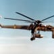 A CH-54 with a parachute bomb, "daisy cutters".