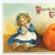 Vintage Thanksgiving postcards: Little girl and pumpkin