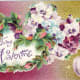 Free vintage valentine greeting card with hearts made of pansies and pink rosebuds; hammered tin background