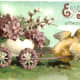 Baby chick pulling Easter egg cart full of flowers