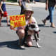 Official events start with the "Dog Parade" here a volunteer is walking a dog in need of an owner.