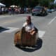 Shriners buzz around on go carts dressed up as canoes