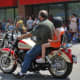 Several riders show off their bikes.