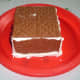 Paste the 2 rectangular Graham Crackers or gingerbread together and paste it on top pf the walls as a ceiling.