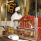 The Guru Granth Sahib, the Holy book of the Sikhs is kept on a manji (throne), on a raised platform in the center of the room. It is covered with a cloth called Rumala Sahib at all times as a mark of respect. 
